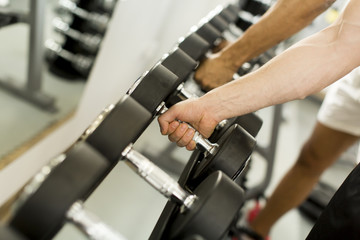 Obraz na płótnie Canvas Dumbbell in the gym