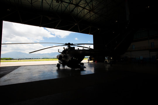 silhouette of a helicopter in the hangar