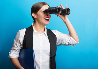 Business woman with a binoculars