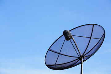 satellite dish against blue sky.