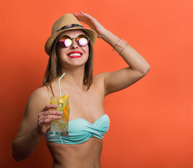Woman in bikini with a cold drink