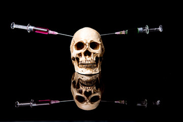 Human skull and Medical equipment on black background