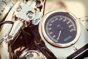 Motorcycle detail with mirror, speedometer and handlebar