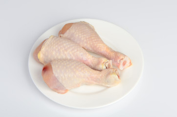 chicken legs on the plate with parsley