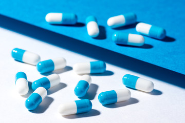 cure capsule on a white and blue paper background
