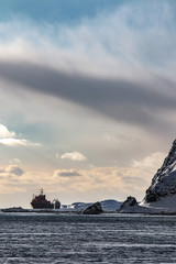 Fototapeta na wymiar two ships at anchor in the bay of the northern winter