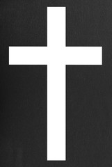 White cross on black background