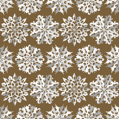 Seamless christmas pattern. Origami snowflakes signs. Paper white cut out silhouettes on gold background. Convex flake icons with shadow. Winter theme texture. Vector illustration.