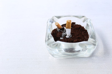 Ashtray on the white table.