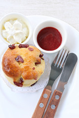 Strawberry jam with walnut and chocolate chip muffins.
