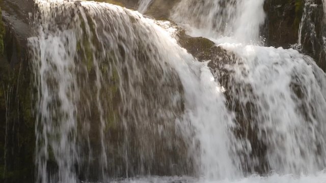 Close up shot of a small waterall with pure fresh clean water, high definition video shot with a Canon 6D