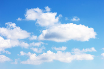 white clouds and blue sky background.
