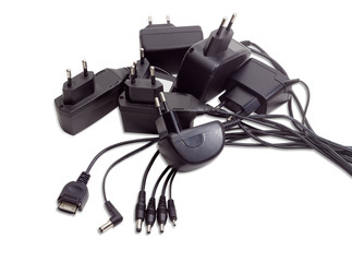 Battery chargers for various gadgets on a light background