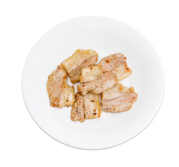 Fried pork on white dish on a light background