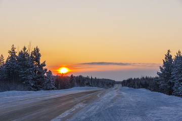 road in winter at sunset