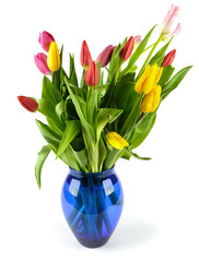 Bouquet of tulips in a blue glass vase.