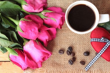 Coffee with coffee beans and red hearts.