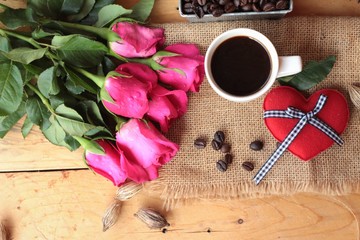 Coffee with coffee beans and red hearts.