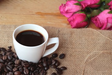 Coffee with coffee beans and red hearts.