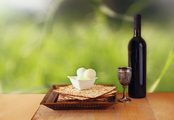 Pesah celebration concept (jewish Passover holiday) with wine and matza
