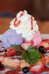 Waffle with ice cream,grape,strawberry and strawberry sauce