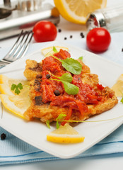 Fried fish with vegetable sauce.