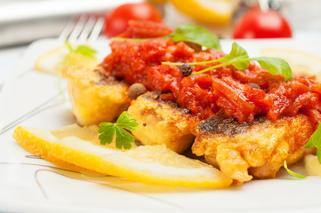 Fried fish with vegetable sauce.