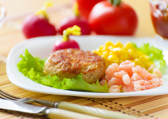 Cutlets with canned corn.