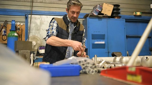 Worker in metallurgy workshop