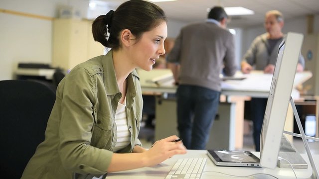 Industrial designer working on desktop computer