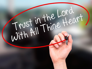 Man Hand writing Trust in the Lord With All Thine Heart with bla