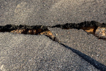 Layer of broken asphalt road at rural areas.
