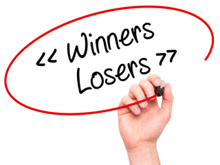 Man Hand writing Winners - Losers  with black marker on visual s