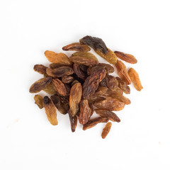 Dried long raisins on a white background top view