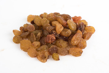 Dried raisins on a white background top front view