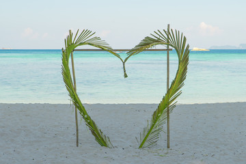 Fototapeta na wymiar Coconut leaves heart in beach at Phuket, Thailand