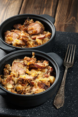 Potatoes baked with sausage and bacon