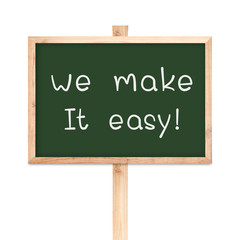 Fototapeta premium We make it easy on blackboard wood label isolated on white backg