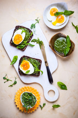 Boiled egg with pesto on toast