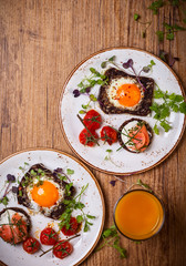 Fried eggs, salmon canape and  tomatoes