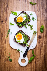 Boiled egg with pesto on toast