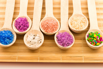 Colorful sea salt in wooden spoons