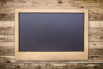 Chalk board on Brown wood plank wall texture background