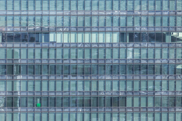 Fototapeta na wymiar Mirror pattern on business building