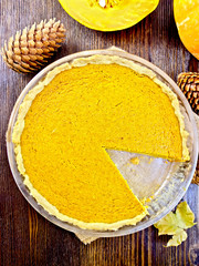 Pie pumpkin in pan on board top