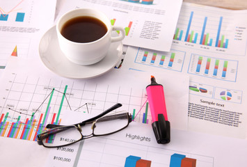 financial and business color charts and graphs on the table