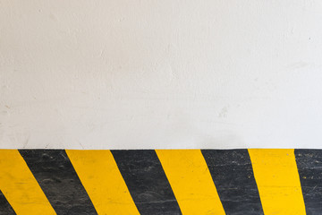 Fototapeta premium White wall and yellow black stripe background.