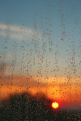 Fototapeta na wymiar Drops of rain on the window