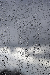 Water drops on a window glass, rainy day
