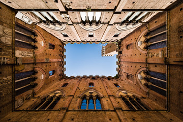 Wide angle view of famous Torre del Mangia in Siena, Tuscany, Italy